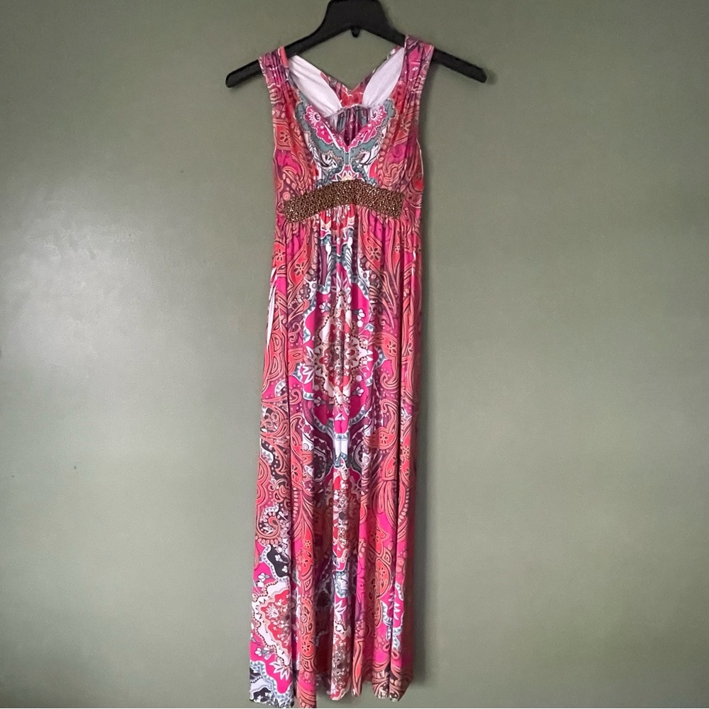 Pink maxi dress with beaded front detail, featuring a flowy design